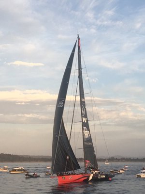 LDV Comanche in sight of the finish, and with a crewman up the mast looking for breeze