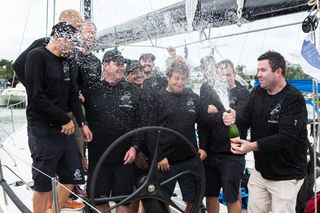 Skipper Sebastian Bohm and crew celebrating their overall win on Smuggler
