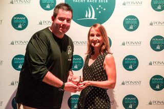 IRC Overall winner, first place ORCi and PHS and 3rd over the line - Smuggler skipper Sebastian Bohm with PONANT Marketing Manager, Australasia Eva Robert