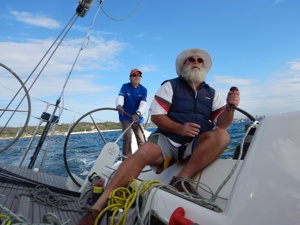Owner Les Goodridge steering with Brett Smith trimming on Wax Lyrical shortly after the start