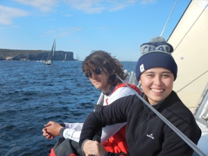   Youth Sailing Academy students Eric Sparkes and India Howard on the rail of Wax Lyrical soon after exiting Sydney Harbour