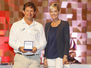 The Honourable Elise Archer MP presenting the Battery Point Trophy for first small boat across the line to Kim Jaggar’s Cinquante, which also won the CYCA Trophy for 2nd in the Corinthian Division