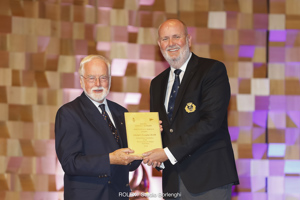 Cruising Yacht Club of Australia Commodore Paul Billingham presenting a Meritorious Service Award to RYCT Past Commodore Alastair Douglas, OAM