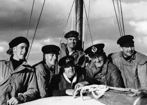 Wayfarer crew in the 1945 Sydney Hobart race.  L to R: Geoff Ruggles, Len Wilsford, Brigadier Arthur Mills, Peter Luke (at rear),  Bill Lieberman, Fred Harris