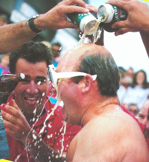 Tony Cable having a VB shower after the Sovereign double win the 1987 Sydney Hobart
