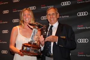 Eve crew member collects trophy from CYCA Vice Commodore Arthur Lane.