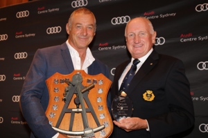 Ichi Ban Sailing Master Gordon Maguire collects Will Oxley's CYCA Ocean Racing Navigator of the Year trophy.