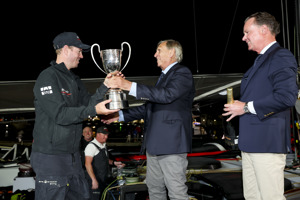 Commodore Arthur Lane presents the Illingworth Cup to Andoo Comanche skipper John Winning Jr.