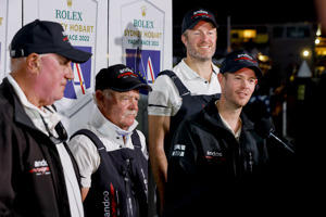 Andoo Comanche skipper John Winning Jr. and other crew members at teh dockside presentation after the finish