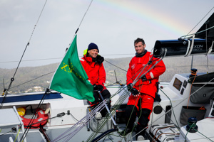 Rupert Henry (L) and Jack Bouttell (R), co-skippers of Mistral, approaching the finish line