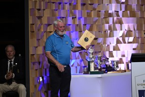 Lindsay May with his '50 Race' medallion presented to him by Minister Nic Street, in his case for a record 50 consecutive races.