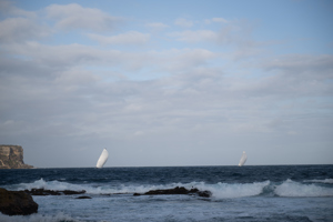 Reichel Pugh 63 No Limit passing through Sydney Heads, pursued by Caro.   Image: CYCA | Vito Feremans
