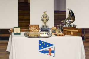 The Rolex Yacht-Master Timepiece and some of the other trophies, including the George Adams Tattersall Cup, awarded to the winning boat Celestial V70.    