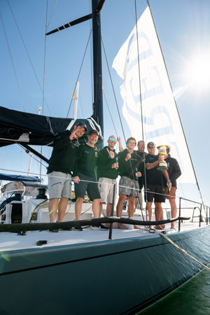 Some of the crew of Smuggler celebrating their win.    Image: CYCA | Ashley Dart