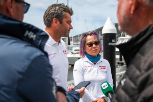 The co-skippers of Min River speaking to the media after the announcement of the outcome of the protest.    Image: CYCA | Ashley Dart