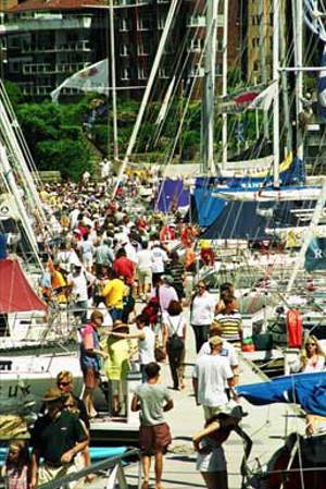 Spectators and crew crowd the marina on race morning