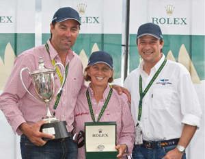 Rolex Sydney Hobart Line Honours Presentation (L to R): Mark Richards, skipper of Wild Oats XI holding the JH Illingworth trophy, Adrienne Cahalan, co-navigator of Wild Oats XI with the Rolex Yacht-Master timepiece, and Patrick Boutellier, Rolex Australia