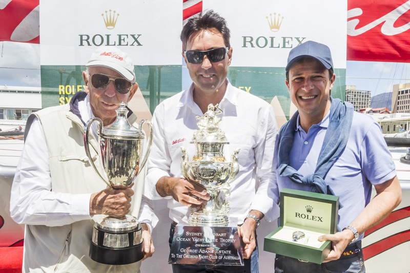 Bob Oatley and Mark Richard with the silverware as Patrick Boutellier presents the Rolex Yacht-Master. 