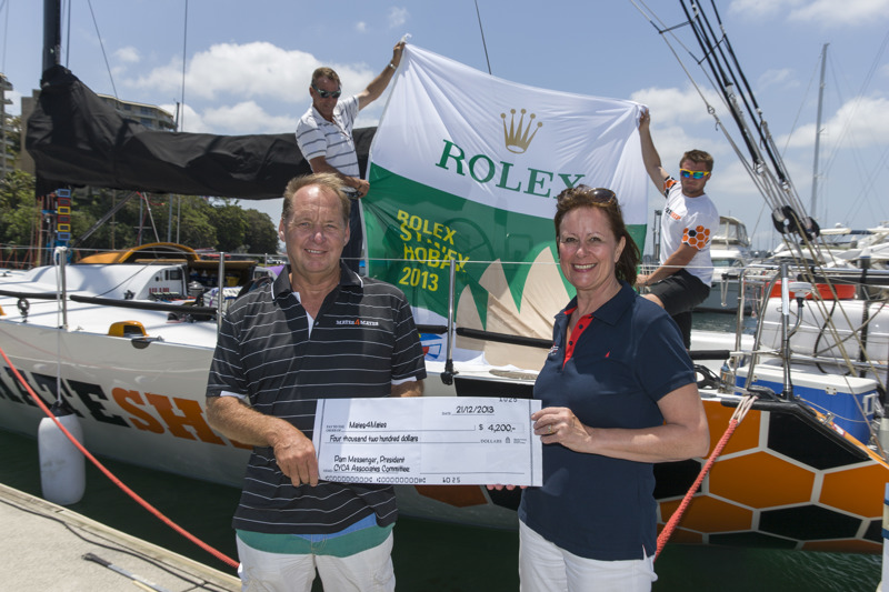 Russell McCart accepts the cheque from CYCA Associates President Pam Messenger
