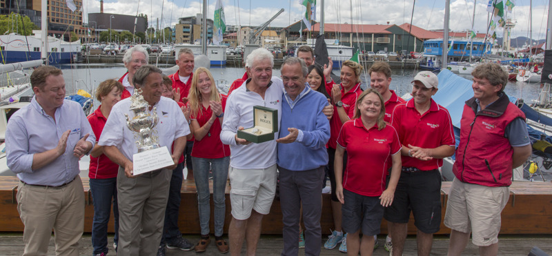 Roger Hickman, Owner Wild Rose, and crew receive the Tattersall's Cup and a Rolex Timepiece.Front row: Richard Batt,  Commodore Royal Yacht Club of Tasmania, John Cameron, Commodore Cruising Yacht Club of Australia, Roger Hickman, Jean-Nöel Bioul, Rolex SA.