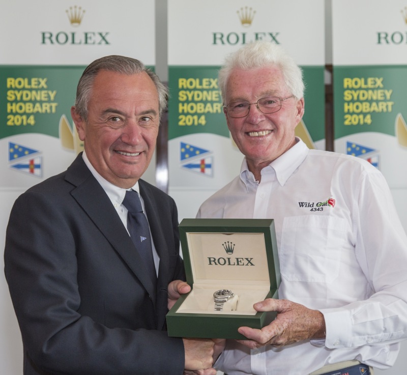 Prize Giving for the 2014 Rolex Sydney Hobart Yacht RaceRoyal Yacht Club of Tasmania (RYCT)Jean-Nöel Bioul, Rolex SA, Roger Hickman, owner/skipper of Wild Rose, presentation of the Rolex timepiece awarded to the race's overall winner