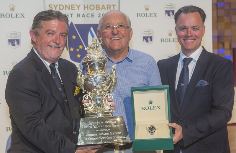CYCA Commodore John Markos, Overall Race Winner Jim Delegat, GIACOMO, receiving a Rolex Oyster Perpetual Yacht-Master 40 and the Tattersall's Cup, Joël Aeschlimann, Rolex Geneva