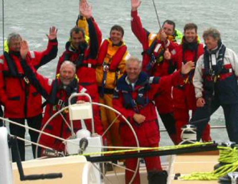 Sir Robin Knox-Johnston (at the helm), crew member of Titania of Cowes